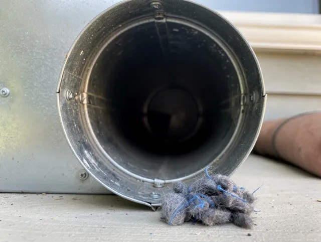 La Puente Dryer Vent Cleaning technician using specialized equipment to clear severe dryer vent blockage in La Puente